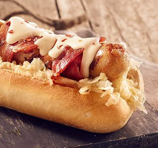 Hot dog with sauerkraut and bacon