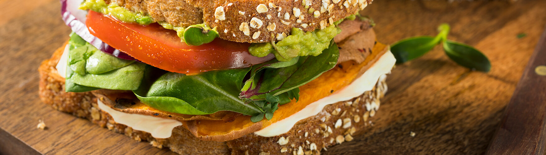 Sandwich with sweet potato, tomato and avocado