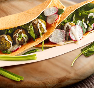 Wrap with falafel, spinach and radishes